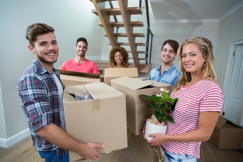 Fulham movers team carefully loading furniture with safety focus
