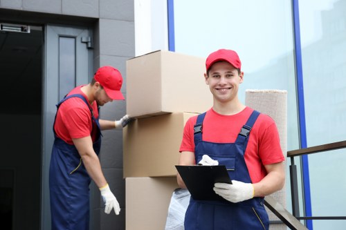 Fulham Movers team sorting recyclable packing materials during a local move