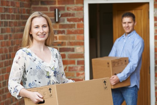 Professional movers loading items with precision and safety
