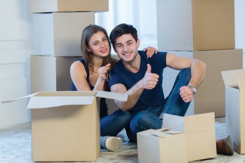 Professional office movers handling furniture and equipment during a Fulham business move