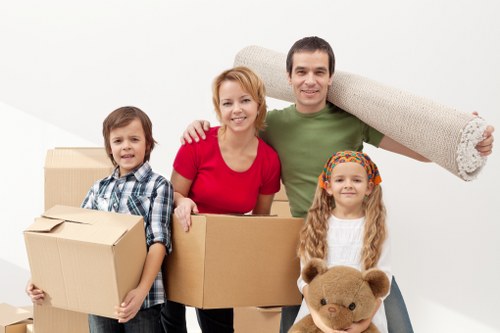 Mover carrying items from a traditional Fulham property
