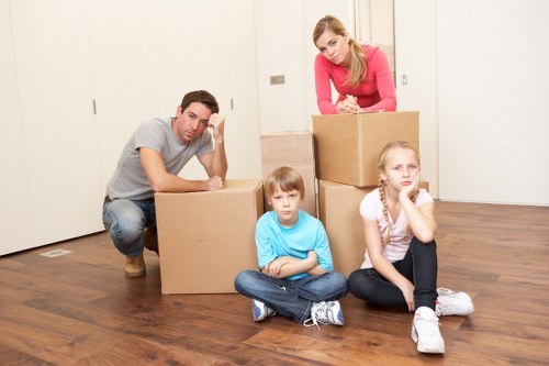 Professional movers handling office relocation equipment in Fulham