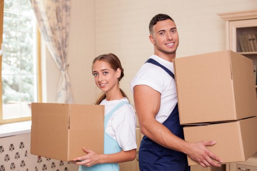 Packed boxes and furniture ready for collection in a Fulham flat
