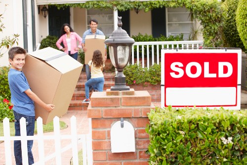 Unpacking service arranging household items in a new Fulham flat