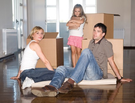 Furniture and boxes being transported by a Fulham moving truck